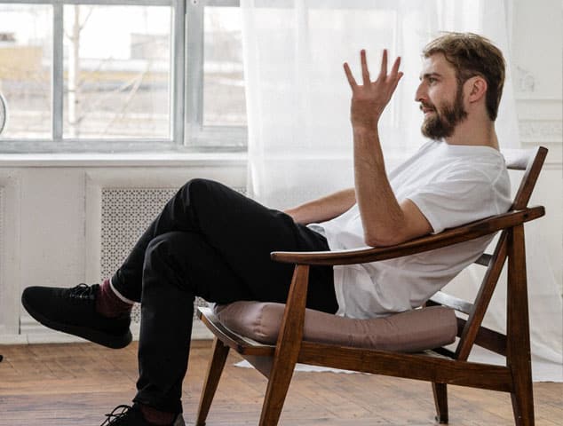 man sitting in counselling session