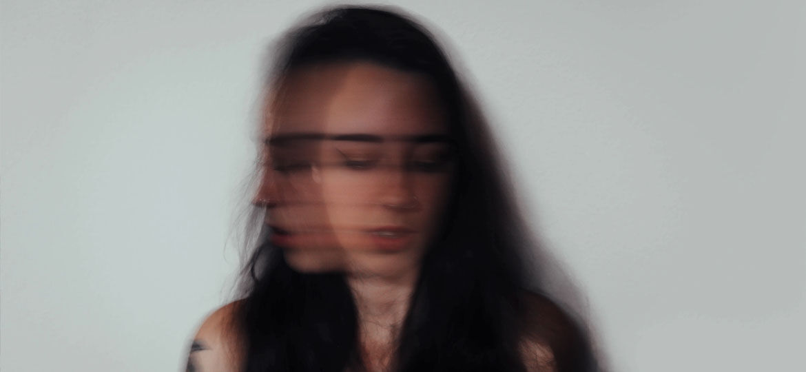 woman shaking head anxiety attack