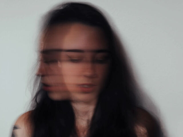 woman shaking head anxiety attack